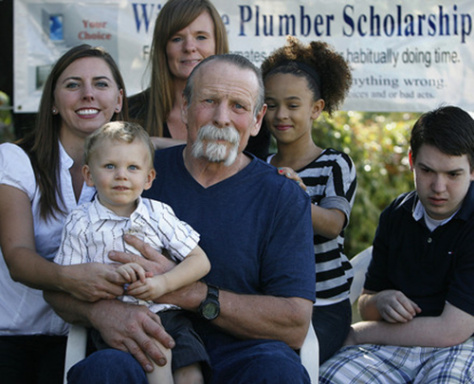 Scott Sommerdorf | The Salt Lake Tribune Karl "Willy" Winsness surrounded by his immediate family at a family barbecue, Saturday, September 29, 2012. From left; daughter Lisa Curtis, grandson Xander Curtis, daughter Jamie Ainsworth, Willy, granddaughter Keymora Ainsworth, and grandson David Ainsworth. Wilnsness has been in and out of jail his whole life. His last crime landed him there for 17 years. In 2004 he left prison and restarted his work as a plumber. In 2011 he began working on creating a scholarship for the children of inmates or what he calls the "forgotten victims" of their parents crimes.